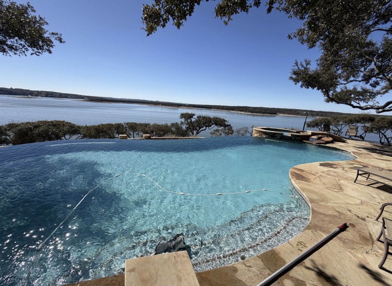 Clean infinity pool overlooking an Austin-area lake