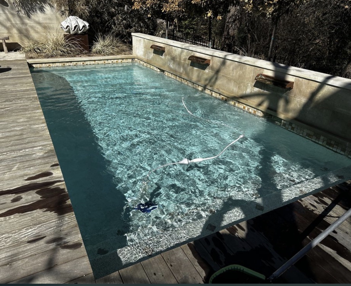 Clean pool with three wall waterfalls